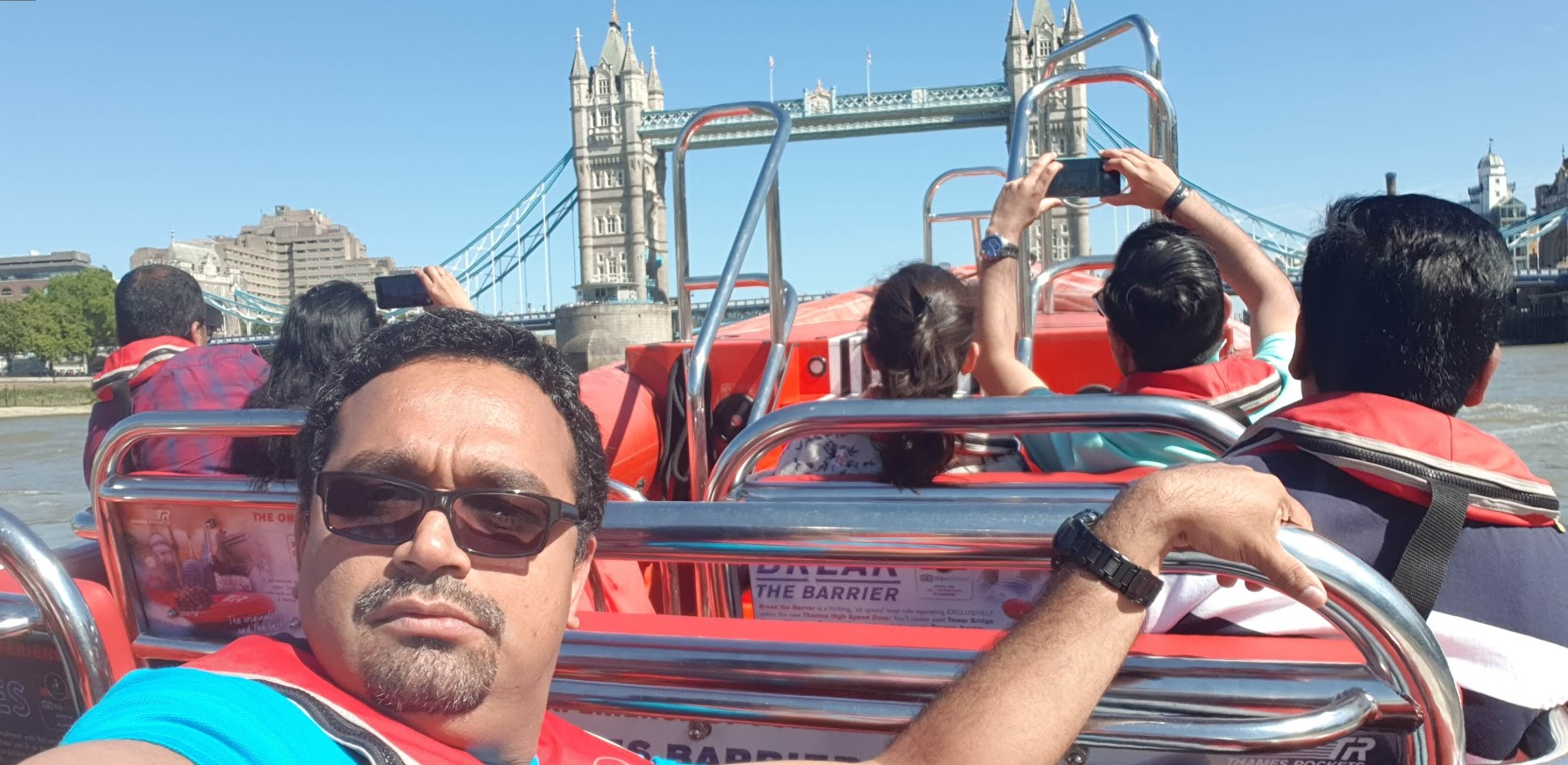 Girish on the River Thames with Tower Bridge behind him